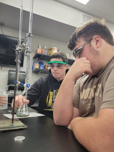 Students from the Advanced Chemistry class taught by Mr. De Vos practiced Acid/Base titration work