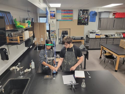 Students from the Advanced Chemistry class taught by Mr. De Vos practiced Acid/Base titration work