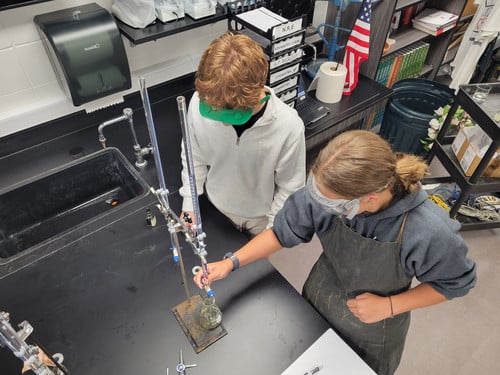 Students from the Advanced Chemistry class taught by Mr. De Vos practiced Acid/Base titration work