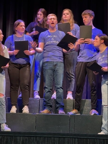 Students giving a group speech performance