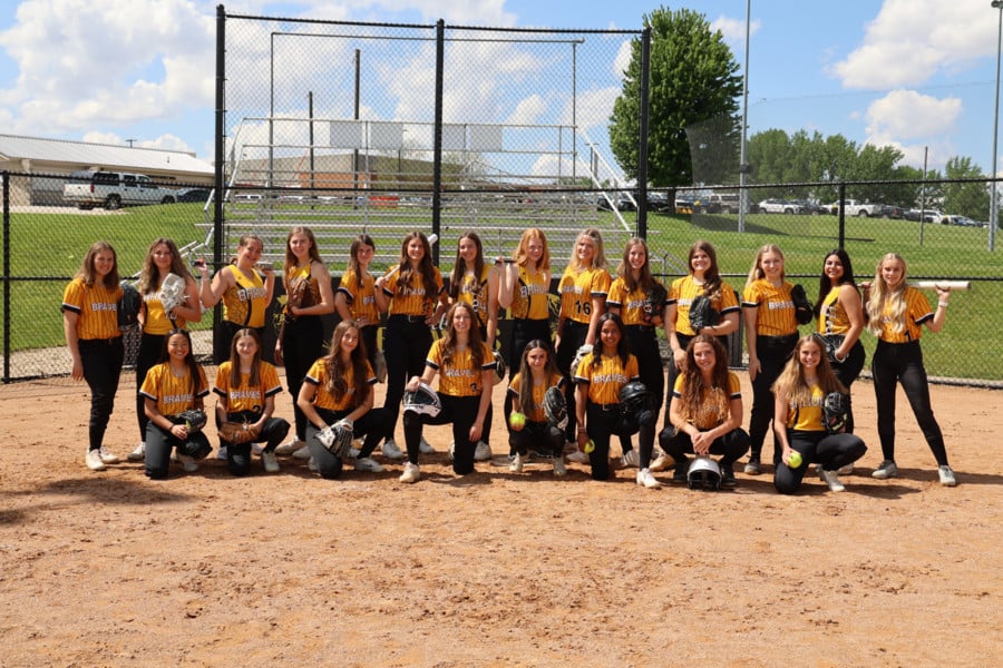 Braves softball team together on field